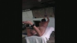 Steve on the table bound caned and paddled